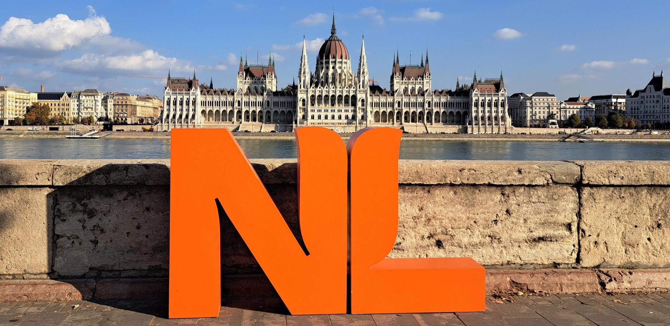 The Netherlands logo and Hungarian Parliament
