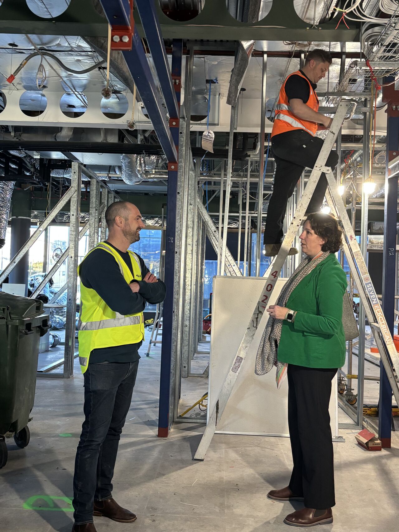 Our operational manager Maartje meets with the construction workers during one of her visits to our new chancery.