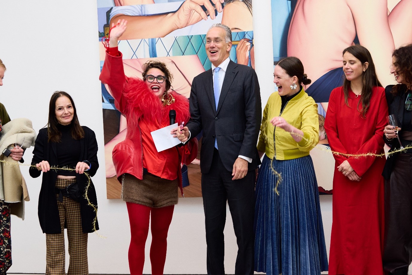 Ambassador Paul Huijts and artist-curator Louise te Poele cut the ribbon during the opening of the exhibition.