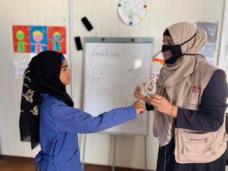 Image: ©UNICEF/El-Noaimi/2021 Hala practices pronunciation with the speech therapist at a school in Za’atari camp. UNICEF/El-Noaimi/2021