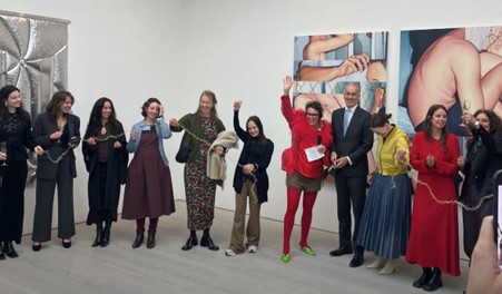 Ambassador Paul Huijts and artist-curator Louise te Poele cut the ribbon during the opening of the exhibition. Next to them, the nine Dutch female artists.